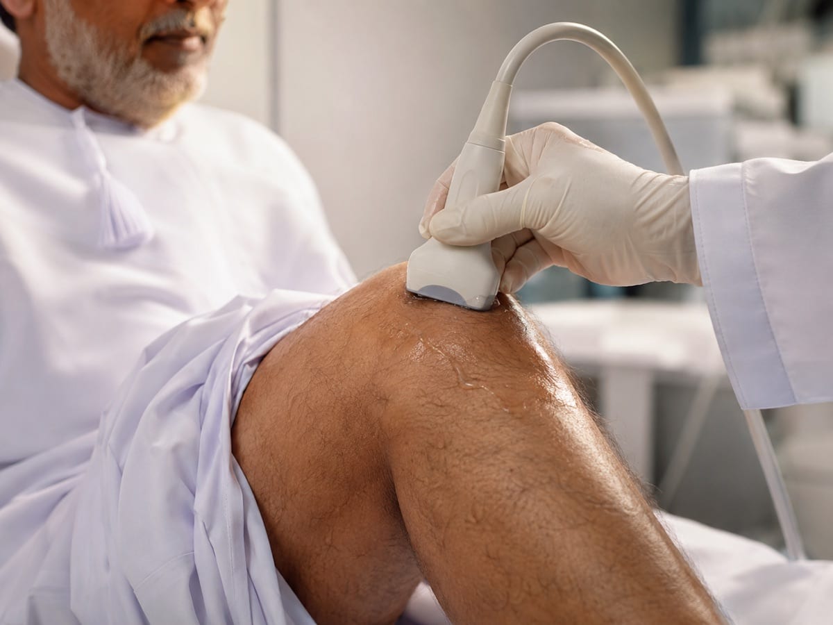 An ultrasound scan of an older patient's knee assessing osteoarthritis.
